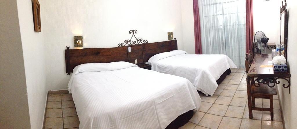 Habitación Doble Deluxe con 2 camas dobles